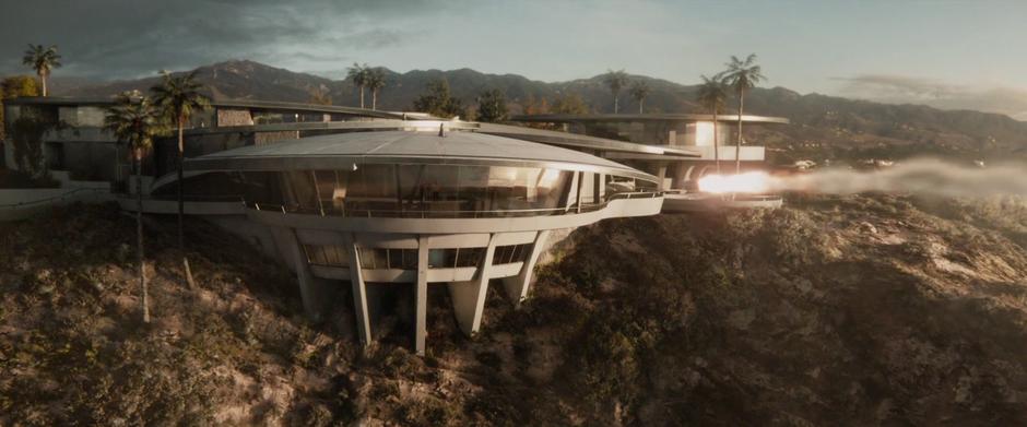 A missile flies towards the Stark mansion where Tony, Pepper, and Maya are talking.