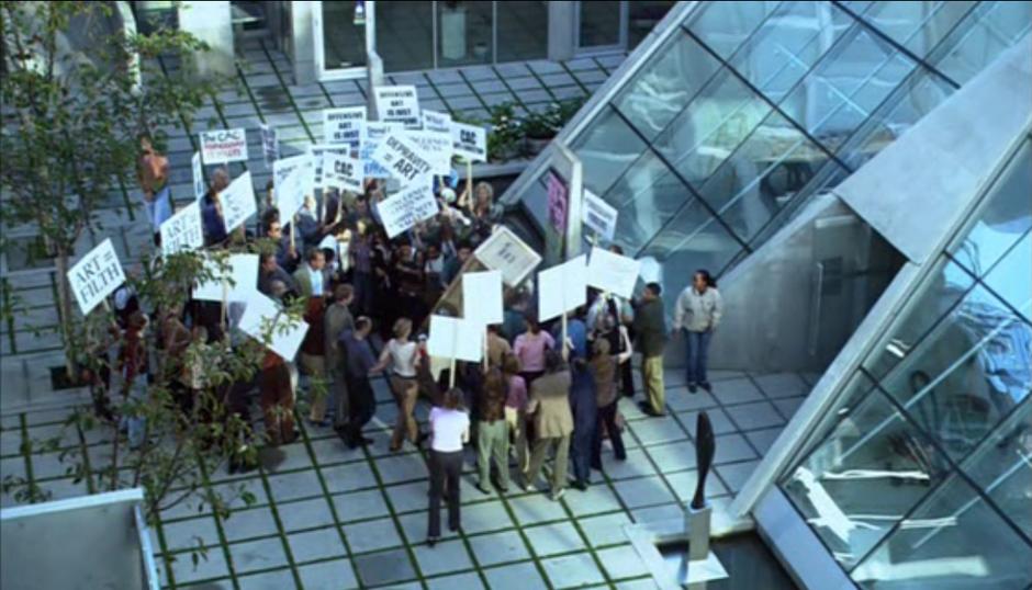 Protestors outside the CAC in season 1 episode "Locked Up".