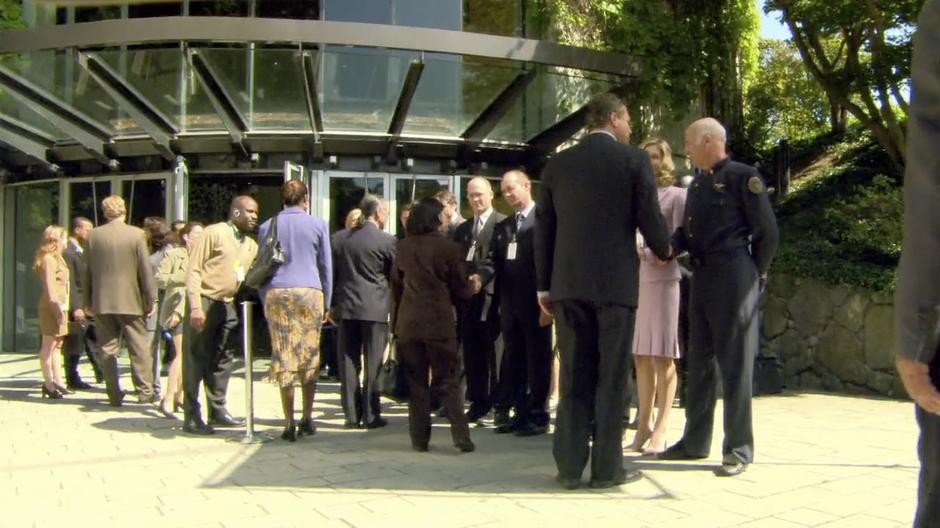 Colonel Tigh and others greeting the delegations on Cloud 9.