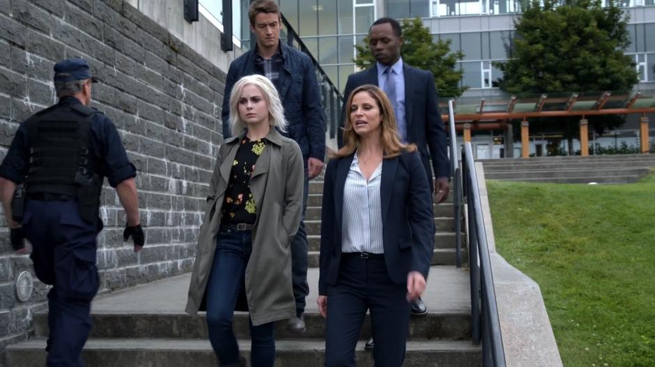 Liv, Vivian, Major, and Clive walk down some stairs while talking about how the staff at Fillmore Graves became zombies.