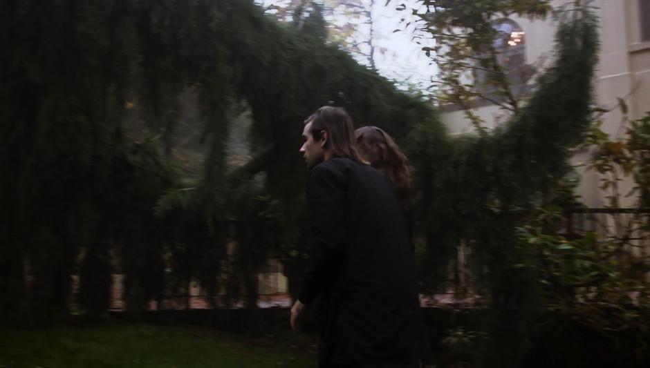 Quentin & Julia walk through the lawn in front of the mansion avoiding the guards.