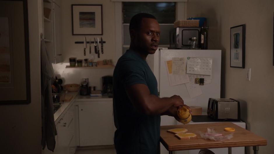 Clive is making a sandwich in his kitchen when he hears yelling and a scuffle from across the hall.