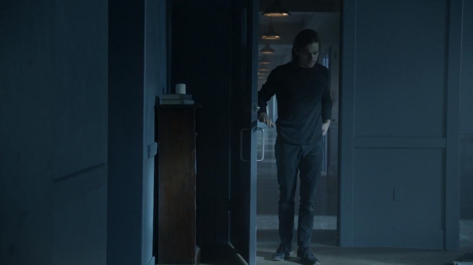 Quentin stands in the door of Alice's room.