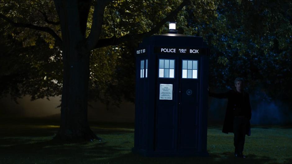 The Doctor stands outside with his Tardis and invites Bill to come along with him.