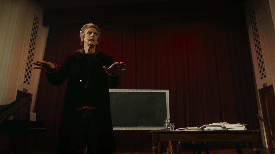 The Doctor gives an impassioned lecture from the stage.