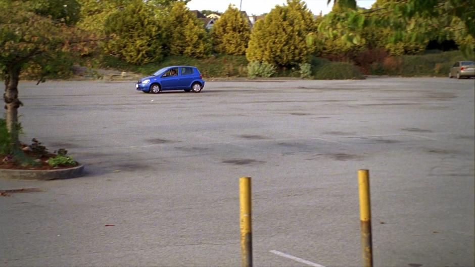 Gus drives around the empty parking lot in his attempt to sneakily head to the Space Center.