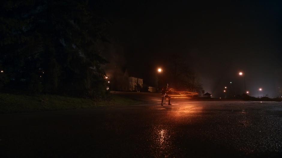 Barry slides to a stop in the middle of the parking lot.