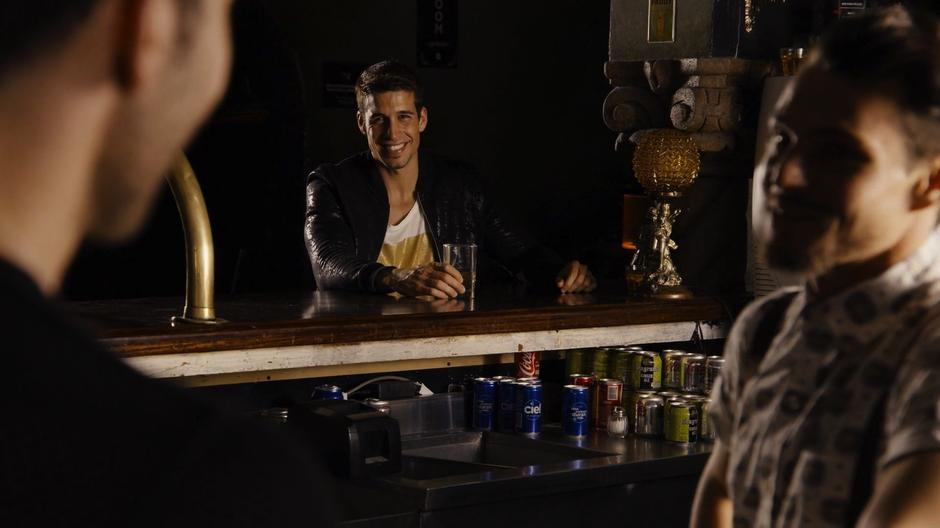 The bartender's new husband gives Lito a smile after the bartender told his story.