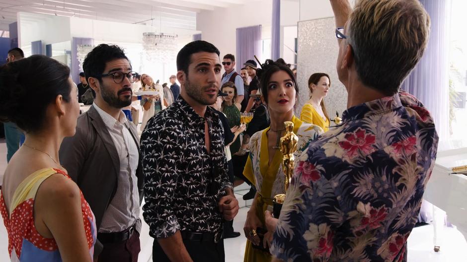 Hernando, Lito, and Dani react after Kit Wrangler tells them what he did with his Academy Award.