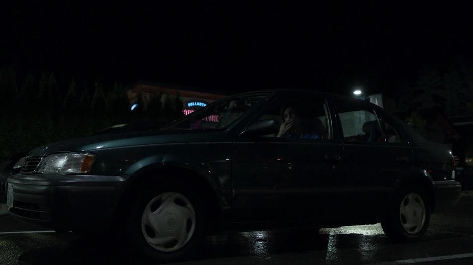 Trish sits in her car getting ready for work.