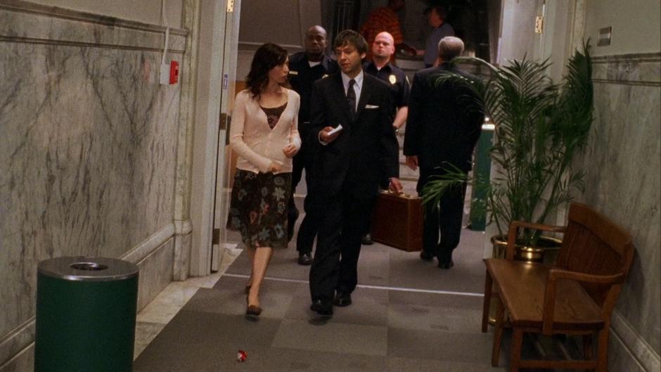 Sandra Panitch walks down the hallway with her lawyer, Adam Hornstock.
