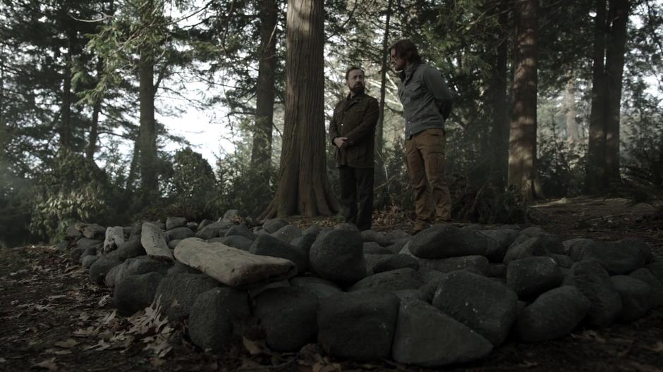 Oliver shows Anatoly the graves of the people he lost on the island.