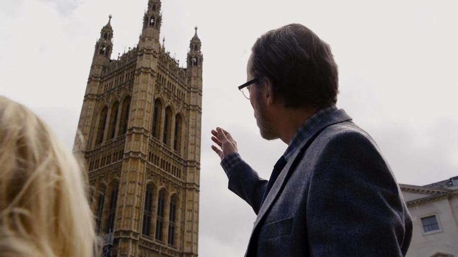 Whispers points up at Victoria Tower while talking about the building with Angelica.