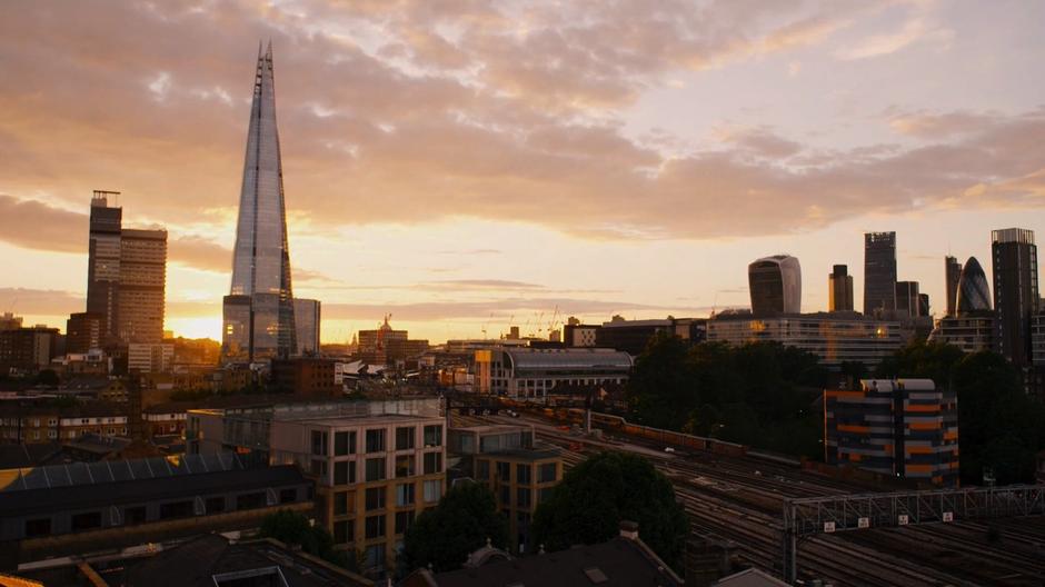 The sunset shines through The Shard and illuminates the London skyline.