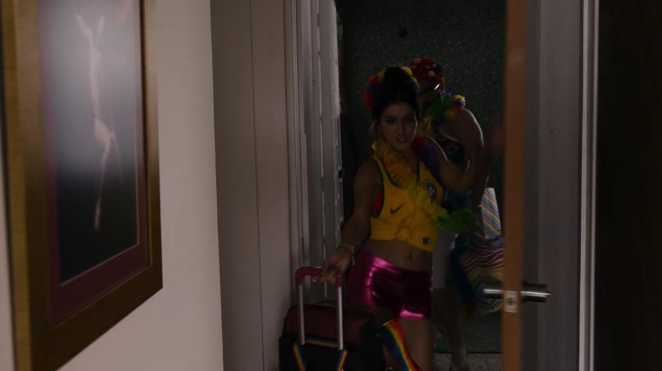 Dani dances back into the apartment followed by Hernando while dressed fancily after their trip.
