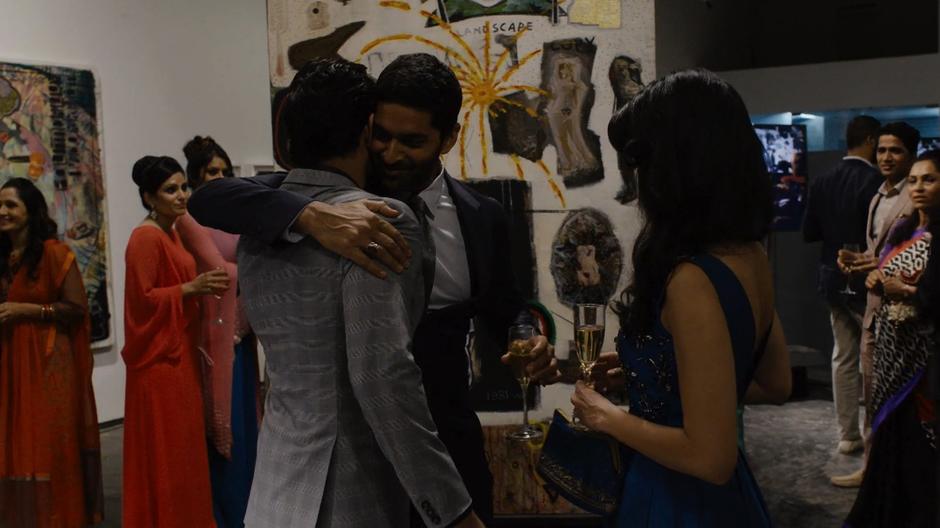 Rajan hugs Ajay while introducing him to Kala.