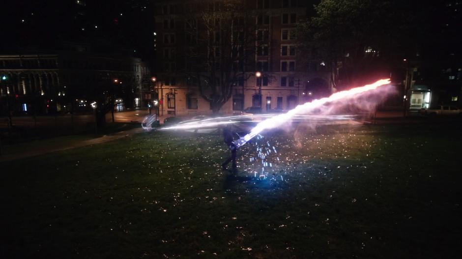 Barry fires the Speed Force Bazooka around the park attempting to hit Savitar.