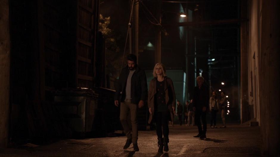 Ravi and Liv walks away from a dejected looking Blaine.
