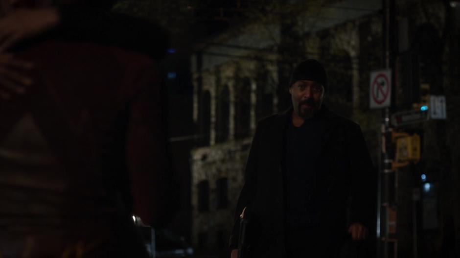 Joe walks up to where Iris and Barry are hugging.