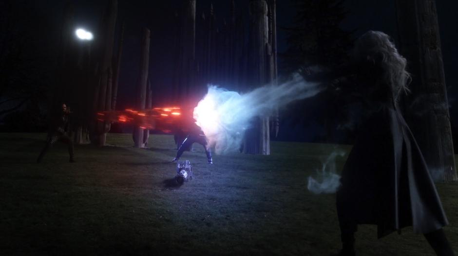 Cynthia and Cisco use their vibes to fight against Killer Frost's cold beam.