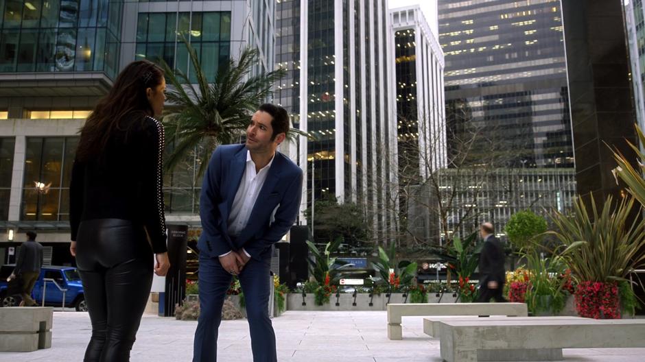 Lucifer tries to talk to Maze about why she is mad in the plaza outside the offices.