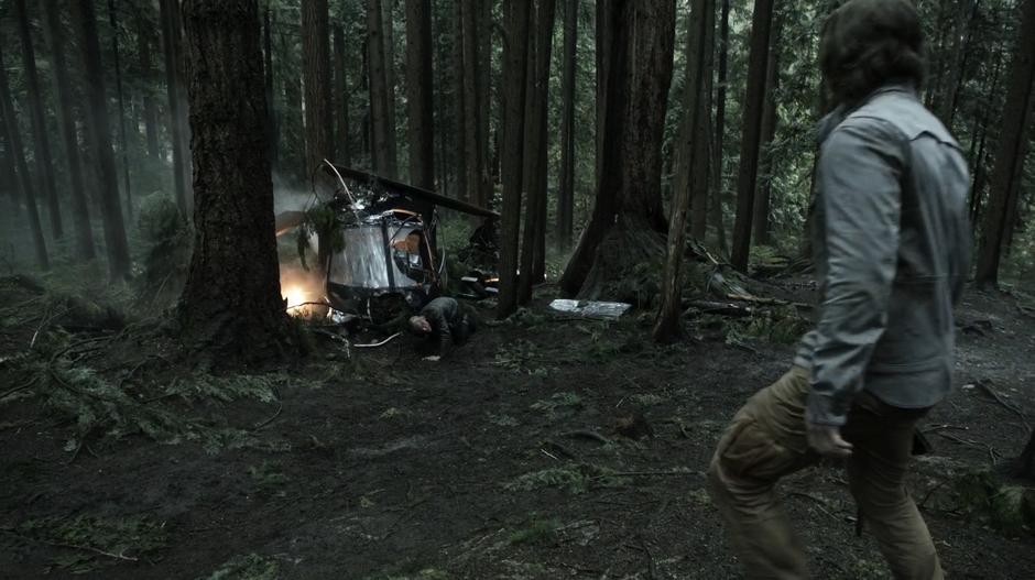 Oliver approaches Konstantin Kovar who is crawling away from the downed helicopter.