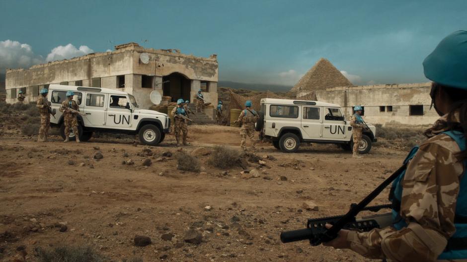 The United Nations guards stand around outside the command post.