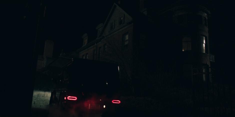 The Waterford's car pulls into the driveway at night.