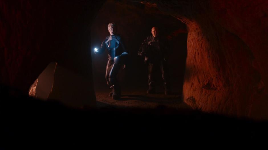 The Doctor and Nardole head down a passageway after Bill falls through a hole in the ground.