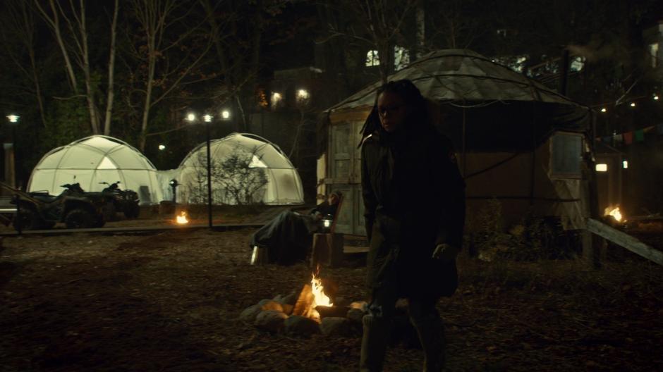 Cosima sneaks past the sleeping Mud and heads towards the medical building.