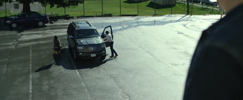 Kim's dad yells at her about her hair as she walks to the car.