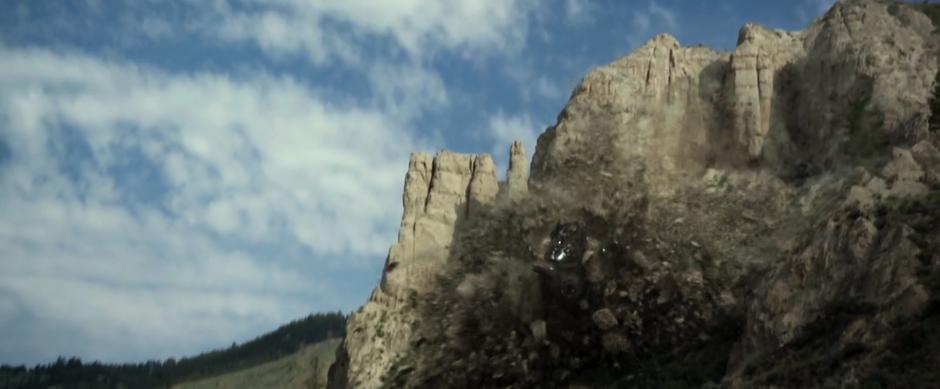 Zack's Zord bursts out of the cliff face.