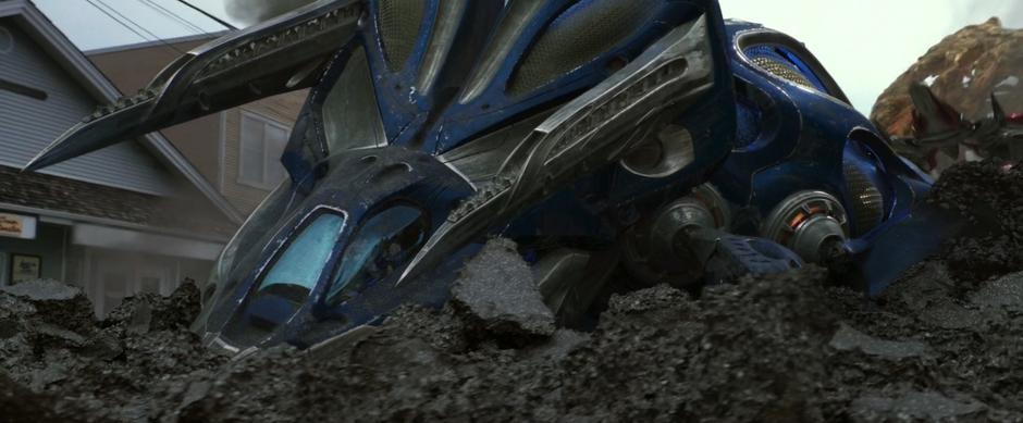 Billy's Zord crashes into the ground.