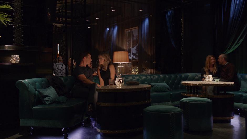 Liv shares her sexual fantasy with Chase Graves on one of the couches in the hotel bar.