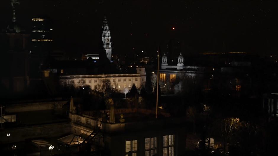 Wide shot of Bill and the Doctor sitting on the roof of the university at night.