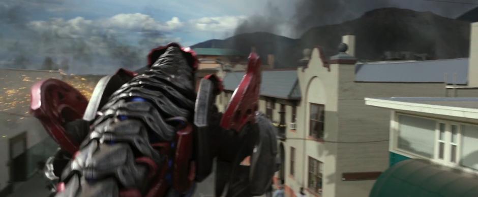 The red Zord reacts after getting his by a Putty.