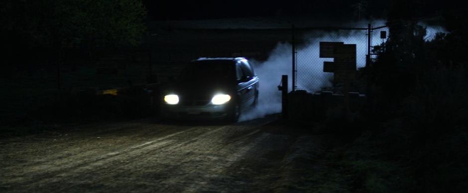 The van races back through the gate in the dead of night.