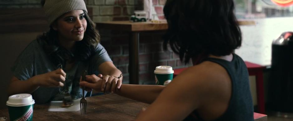 Trini stops Kimberly from spearing the last of her donut during their donut date.