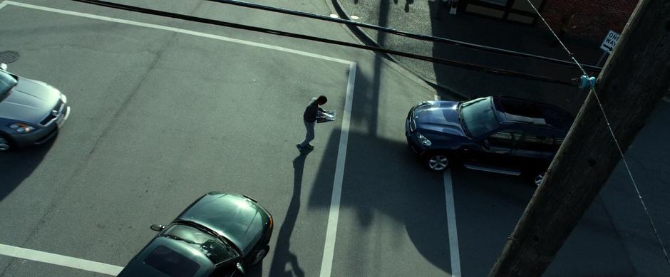 Billy walks through the middle of the intersection and blocks several cars while searching for the maguffin.