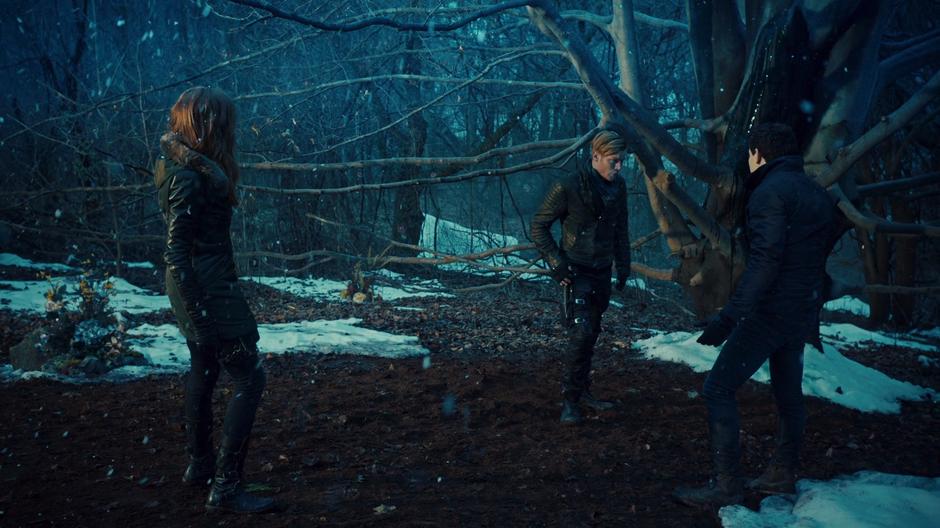 Jace warns Simon about the dangerous tree while Clary watches.