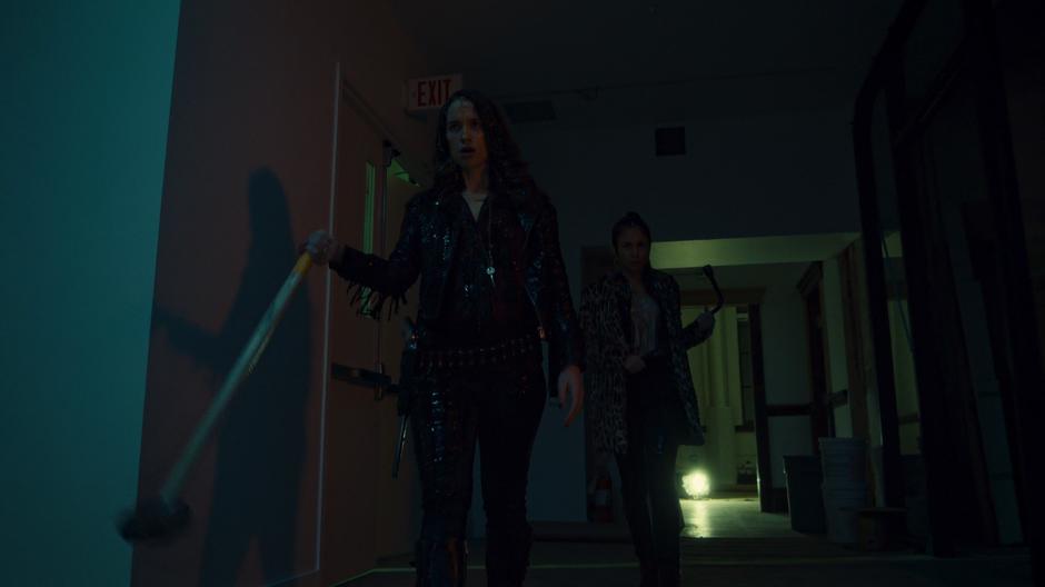 Wynonna and Waverly walk out from the basement covered in goo.