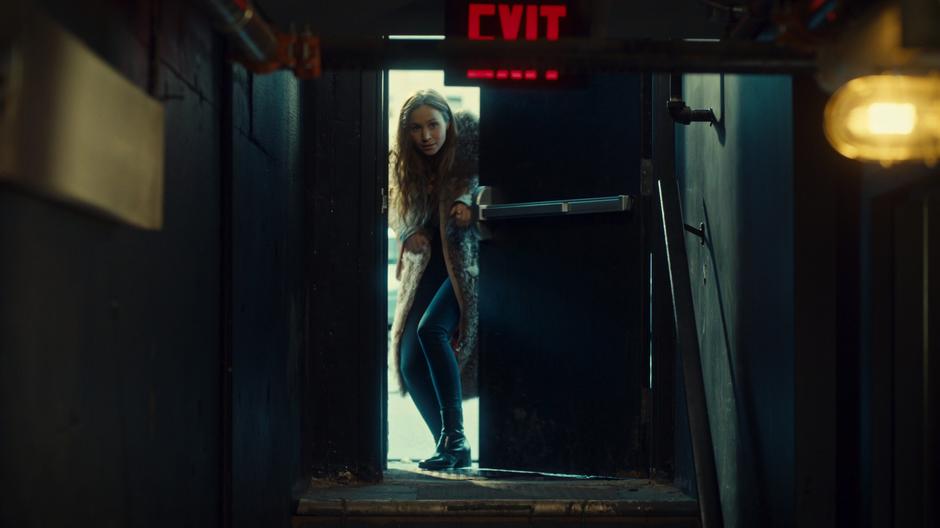 Waverly sneaks in through the back door of the club.