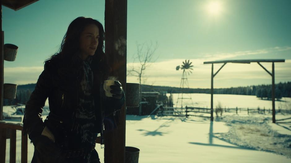 Wynonna talks to Waverly about their plans to hunt the new demons while holding a mug of coffee.