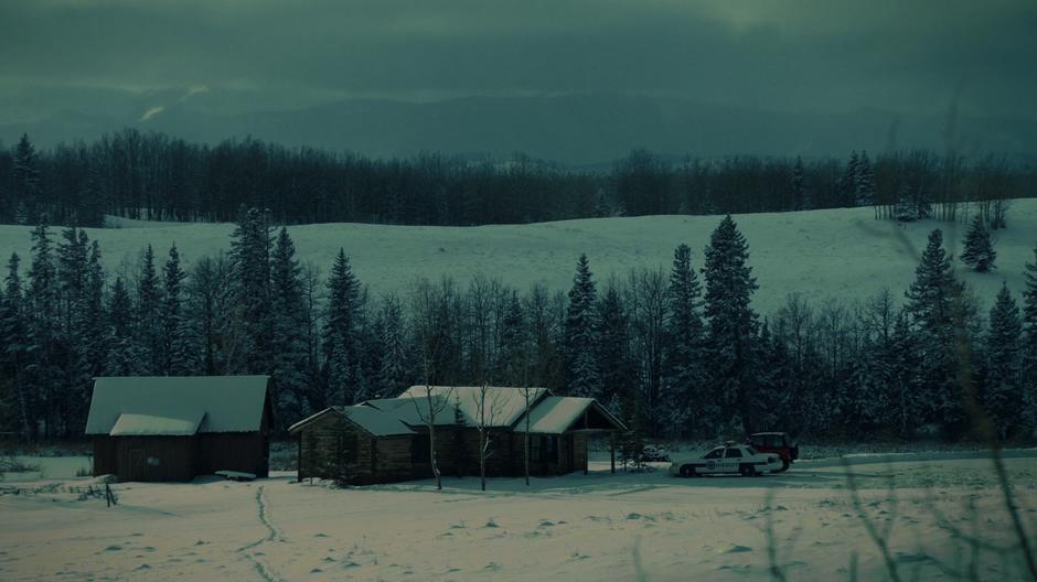 Establishing shot of the homestead and barn with Nicole's squad car and the Jeep sitting out front.