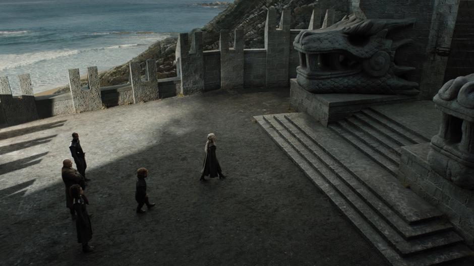 Dany walks towards the gate followed by Tyrion and the others.