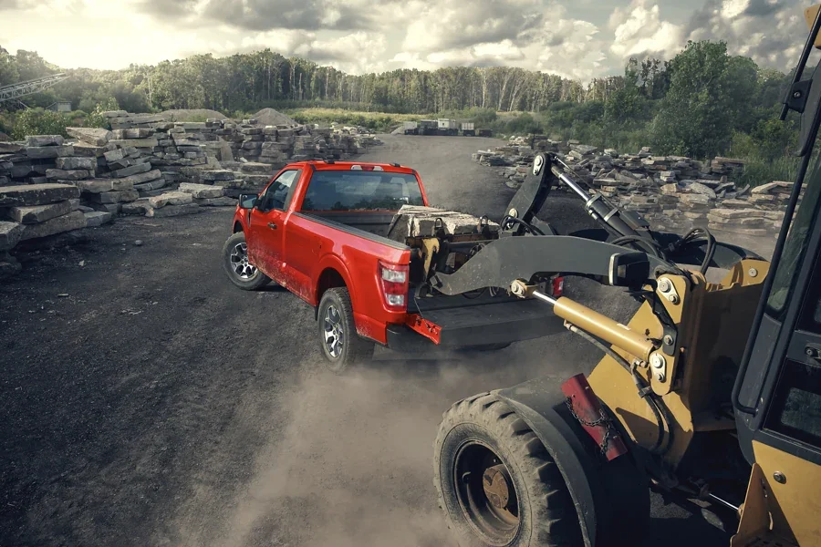 2022 Ford F-150 for sale in Madison, WI Red F-150 getting stone loaded into the bed