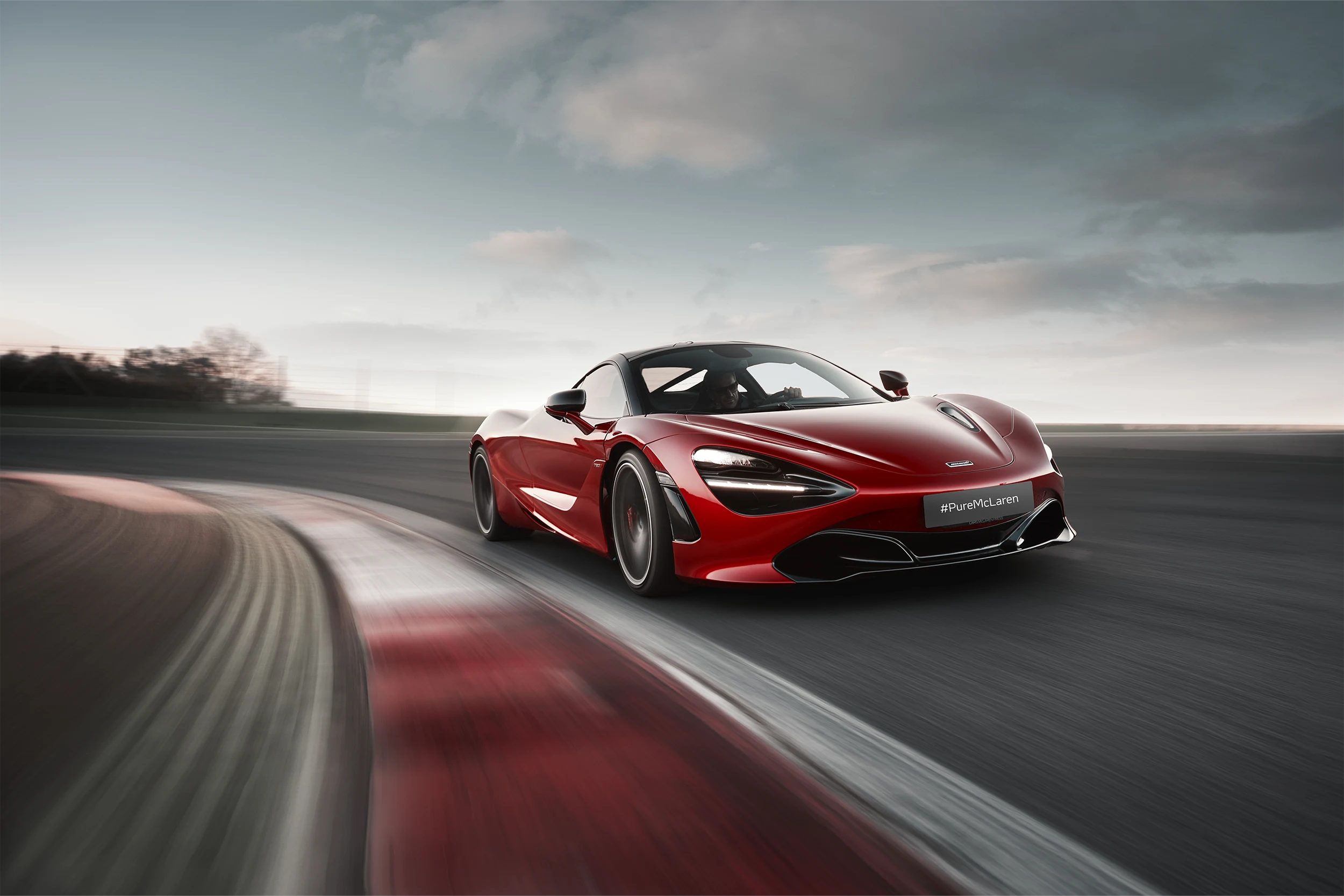McLaren Boston 720S Red 720S driving on road