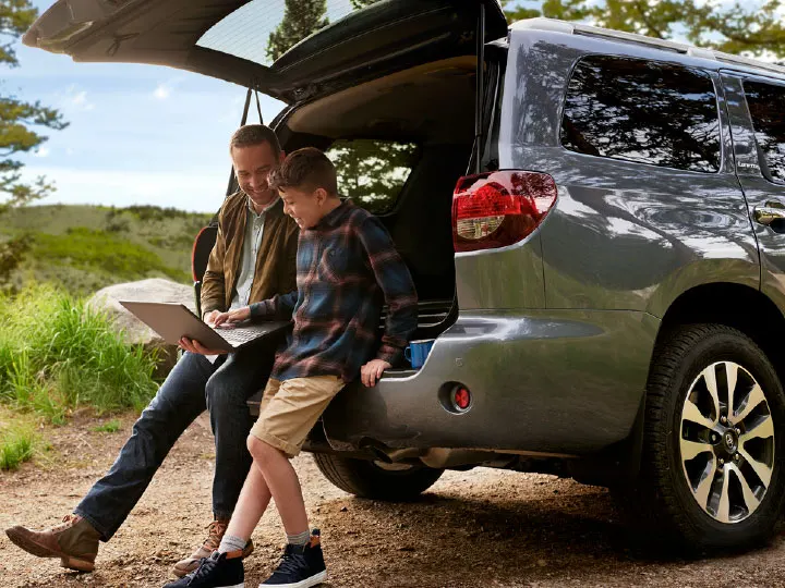 Toyota Certified Father and son sitting in the back of car
