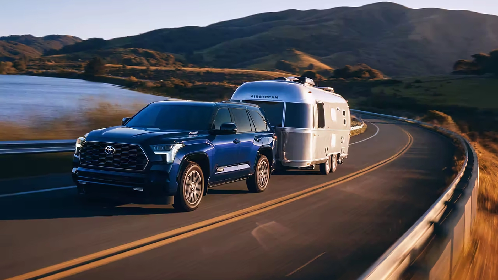 2023 Toyota Sequoia Performance Blueprint 2023 Toyota Sequoia Platinum driving down the road with a trailer in tow