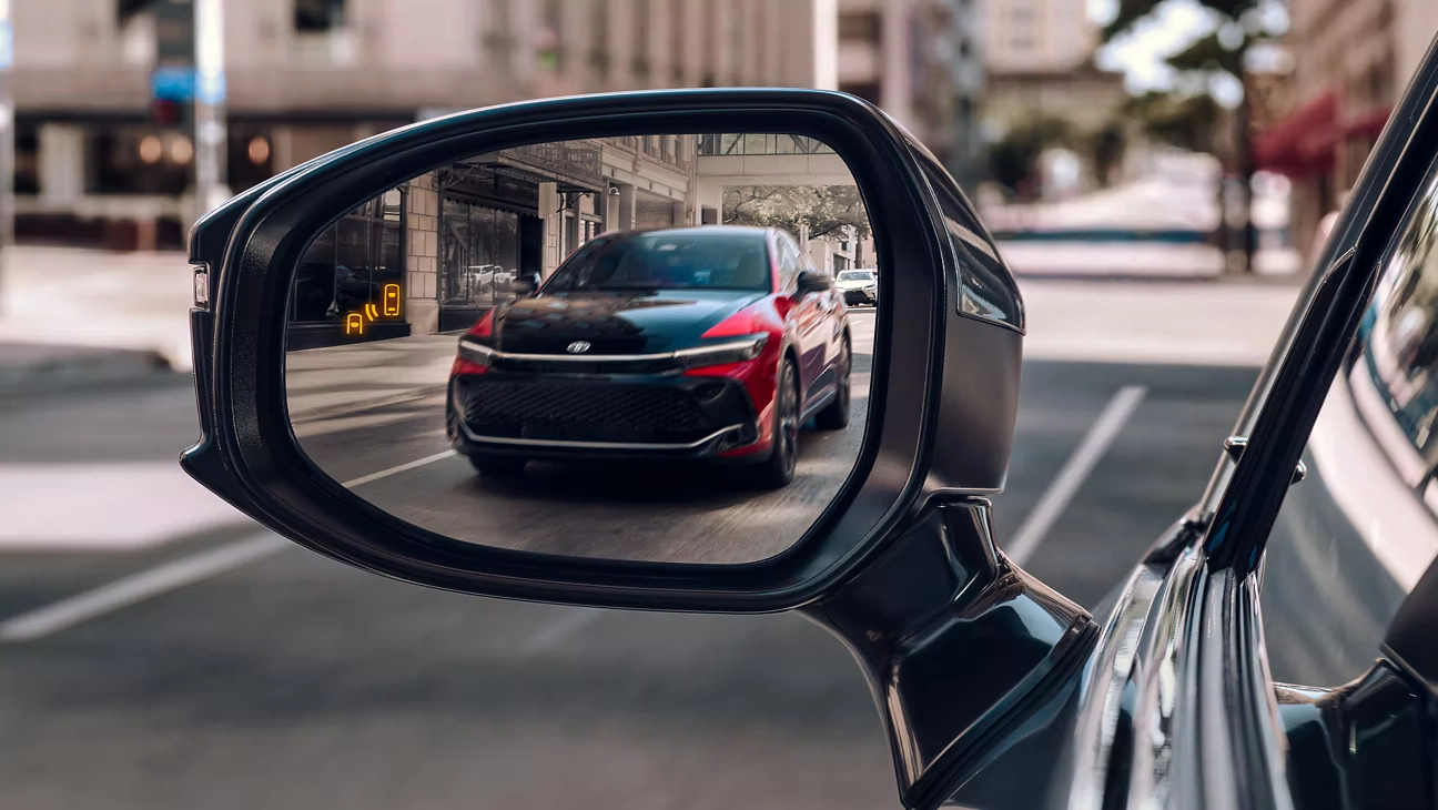 Blind Spot Monitor (BSM) shown on Limited in Heavy Metal with available Advanced Technology Package. Platinum shown in Supersonic Red with Black bi-tone